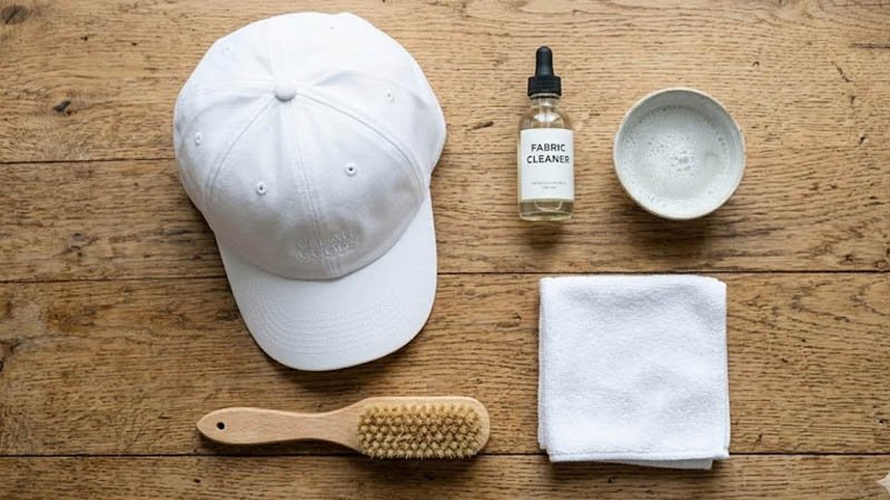 tools for cleaning a white baseball cap