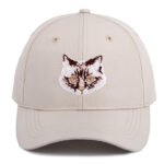 Curved brim baseball cap with detailed embroidered animal design