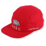 Red flat brim camp cap with embroidered front design