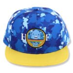 Blue printed snapback hat with yellow flat brim