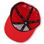 Custom red embroidered snapback hat with flat brim and cotton material
